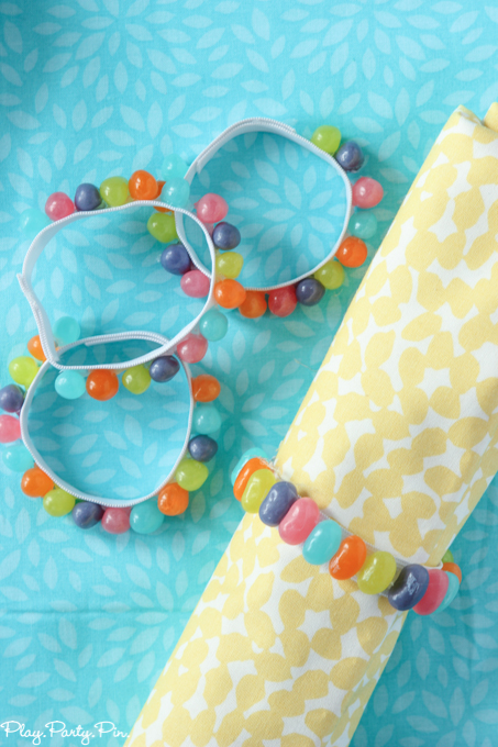 Easy DIY spring napkin rings made from a little bit of elastic, jelly beans, and hot glue. Perfect addition to any spring party!